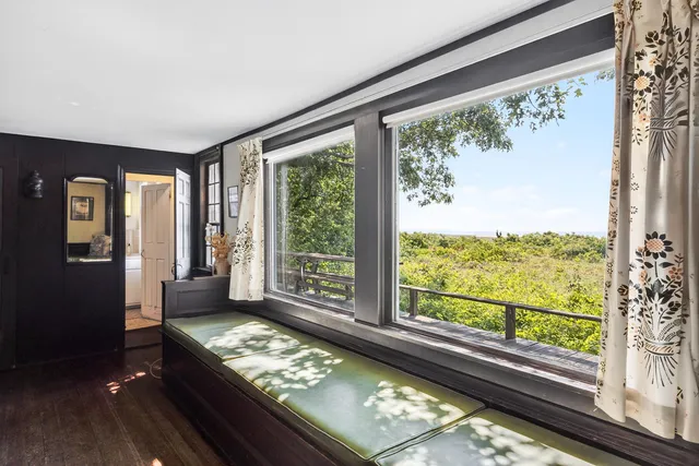 a room with furniture and a large window