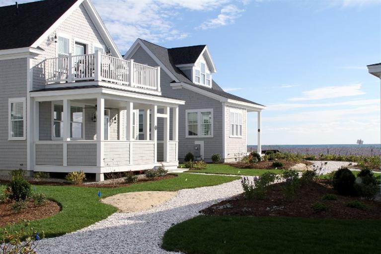 61 Old Wharf Road, Unit 1 Dennis Port, MA 02639 - Photo 2 of 34 a view of a house with a yard