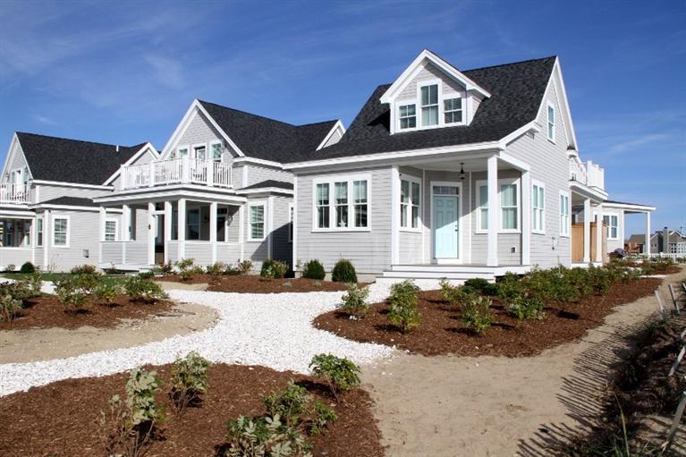 61 Old Wharf Road, Unit 1 Dennis Port, MA 02639 - Photo 28 of 34 a front view of a house with a yard