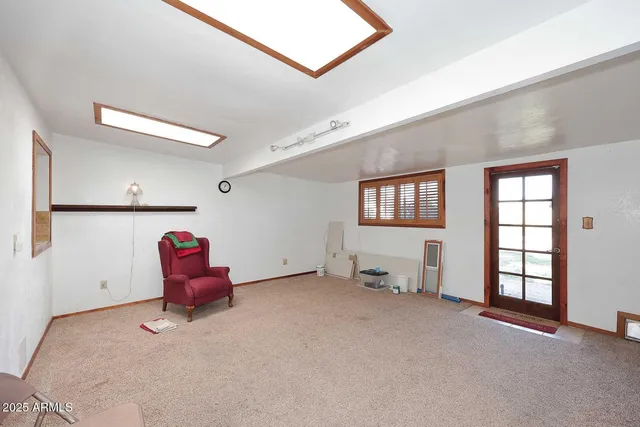 a view of workspace with furniture and windows