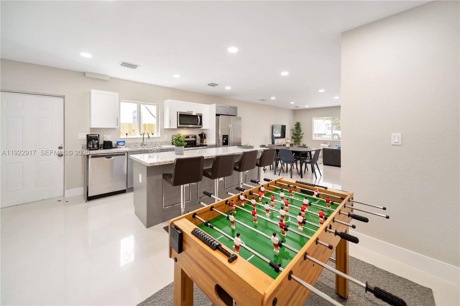 1770 Northwest 55th Street Miami, FL 33142 - Photo 13 of 21 a kitchen with a table and chairs in it