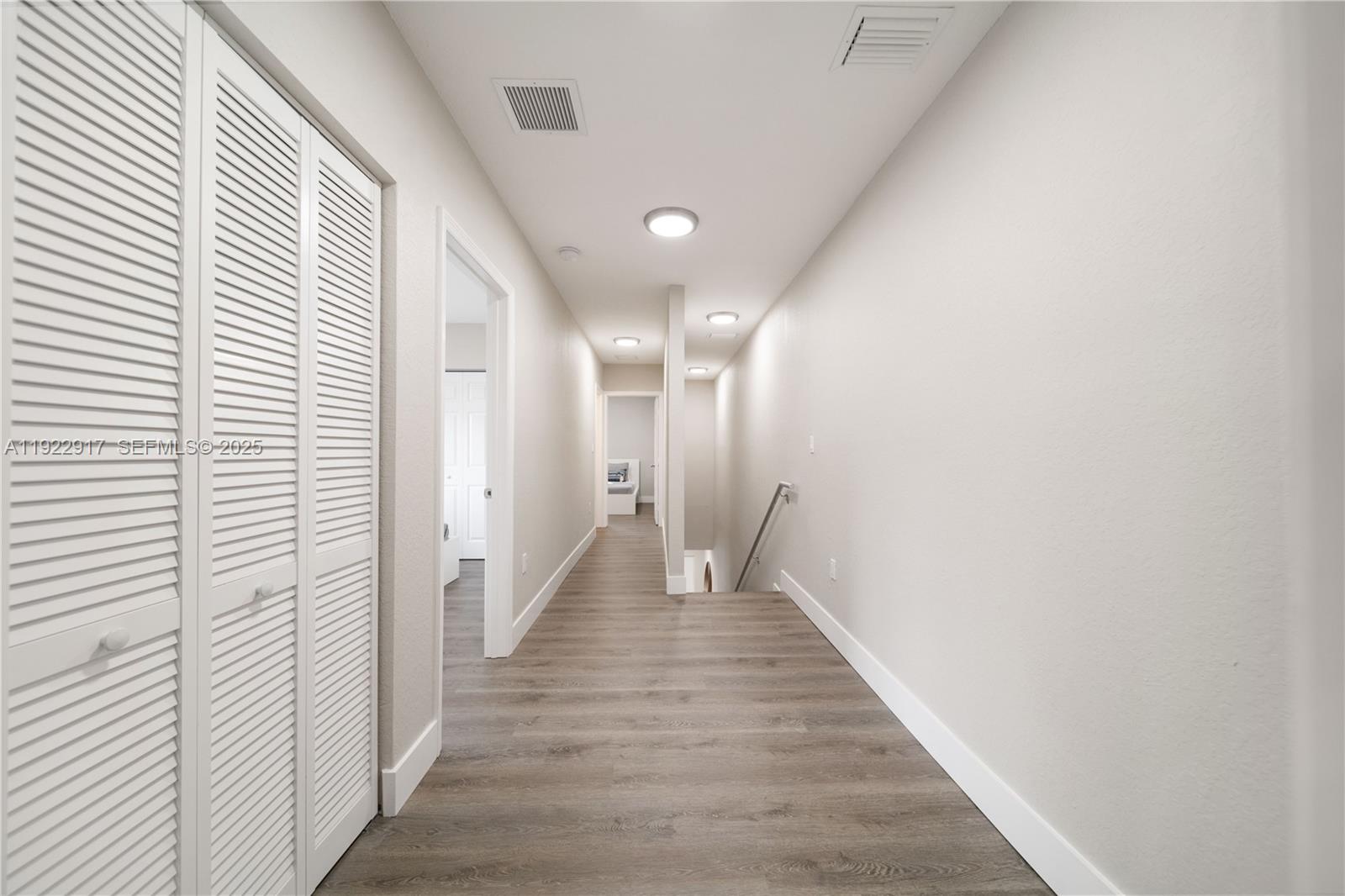 1770 Northwest 55th Street Miami, FL 33142 - Photo 16 of 21 a view of a hallway with wooden floor
