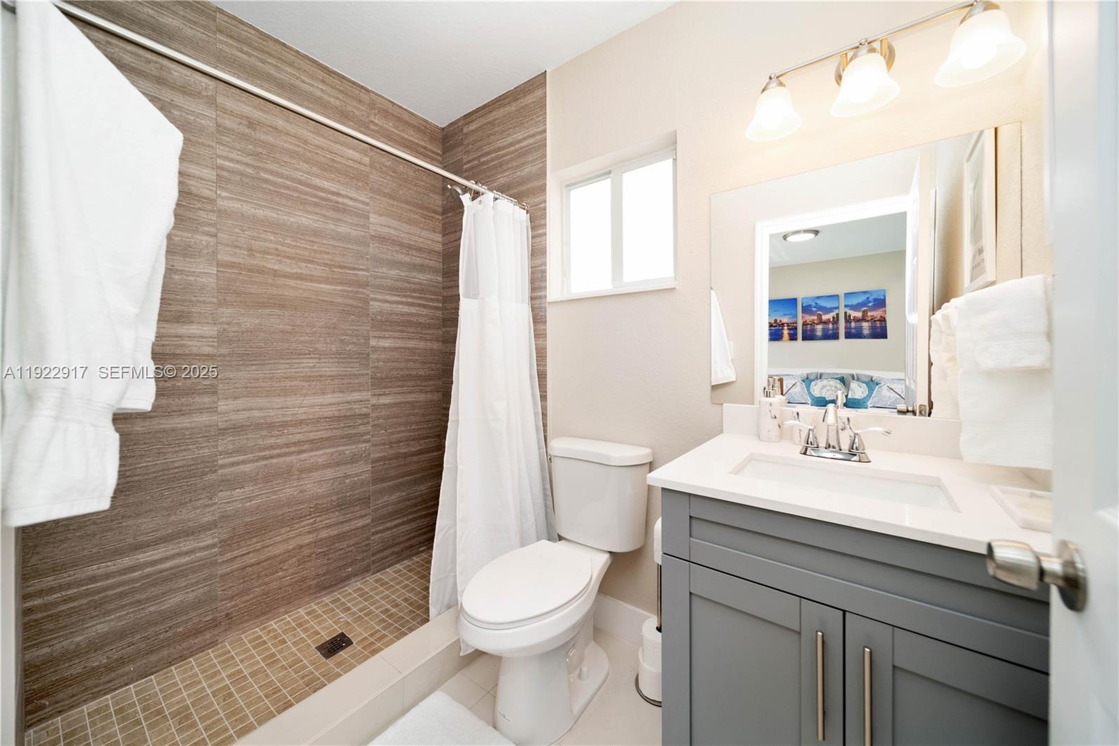 1770 Northwest 55th Street Miami, FL 33142 - Photo 20 of 21 a bathroom with a sink a toilet and shower