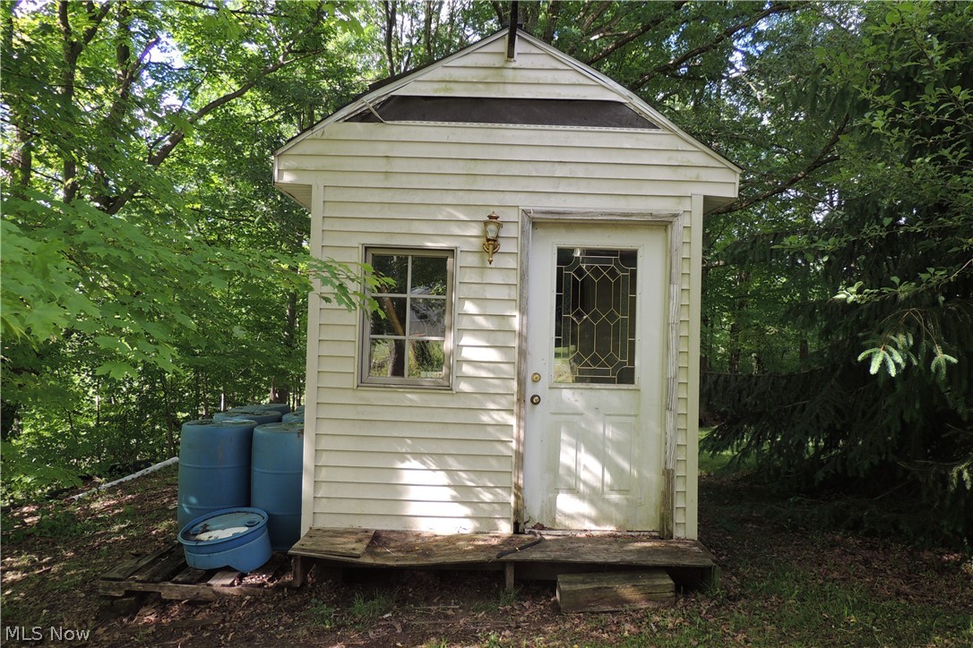 11550 Chamberlain Road Mantua, OH 44255 - Photo 21 of 24 The garden cottage next to the shed.
