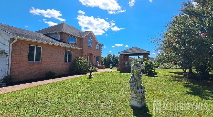58 Bergen Mills Road Monroe Township, NJ 08831 - Photo 3 of 24 a front view of a house with garden
