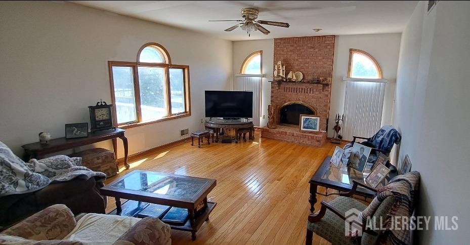 58 Bergen Mills Road Monroe Township, NJ 08831 - Photo 4 of 24 a view of a livingroom with furniture and a fireplace