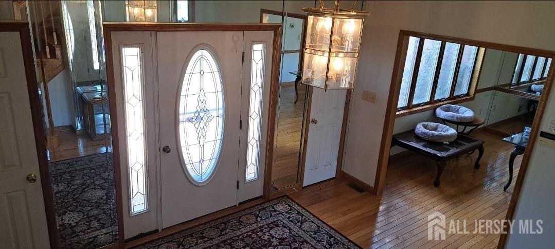 58 Bergen Mills Road Monroe Township, NJ 08831 - Photo 10 of 24 a view of an entryway with wooden floor