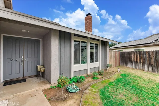 a house view with a backyard space