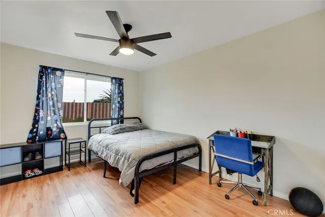 a bed room with a bed and a chair