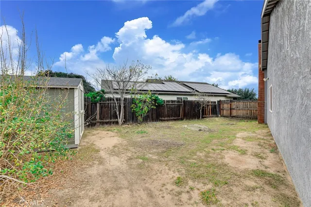 a view of a backyard of the house