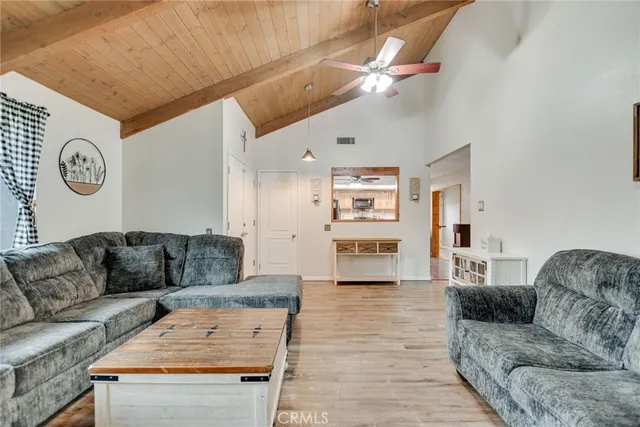 a living room with furniture and a table