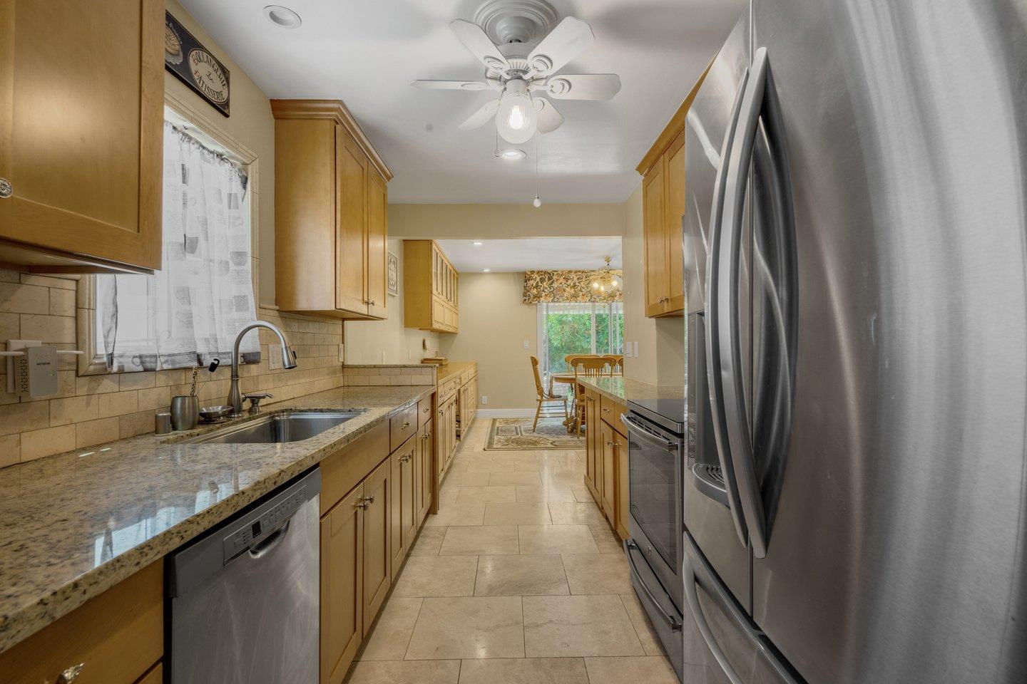 2289 Montezuma Drive Campbell, CA 95008 - Photo 12 of 46 a kitchen with stainless steel appliances granite countertop a sink and a refrigerator