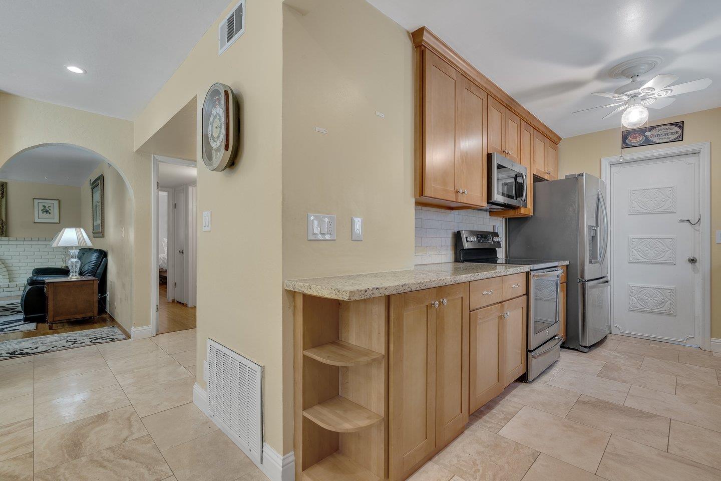 2289 Montezuma Drive Campbell, CA 95008 - Photo 13 of 46 a kitchen with kitchen island cabinets and oven