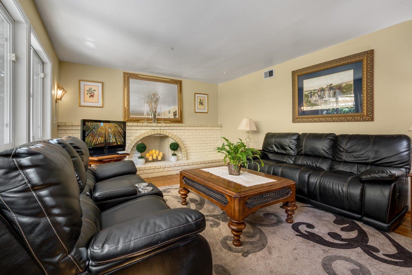 2289 Montezuma Drive Campbell, CA 95008 - Photo 19 of 46 a living room with furniture and a flat screen tv