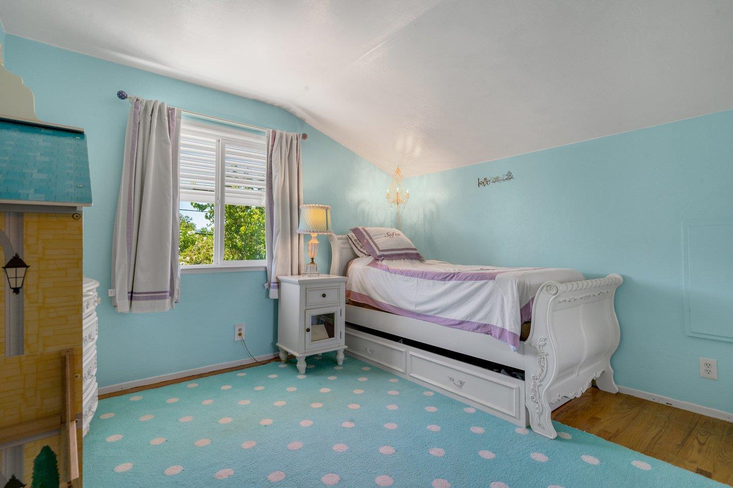 2289 Montezuma Drive Campbell, CA 95008 - Photo 29 of 46 a bedroom with a bed and a window