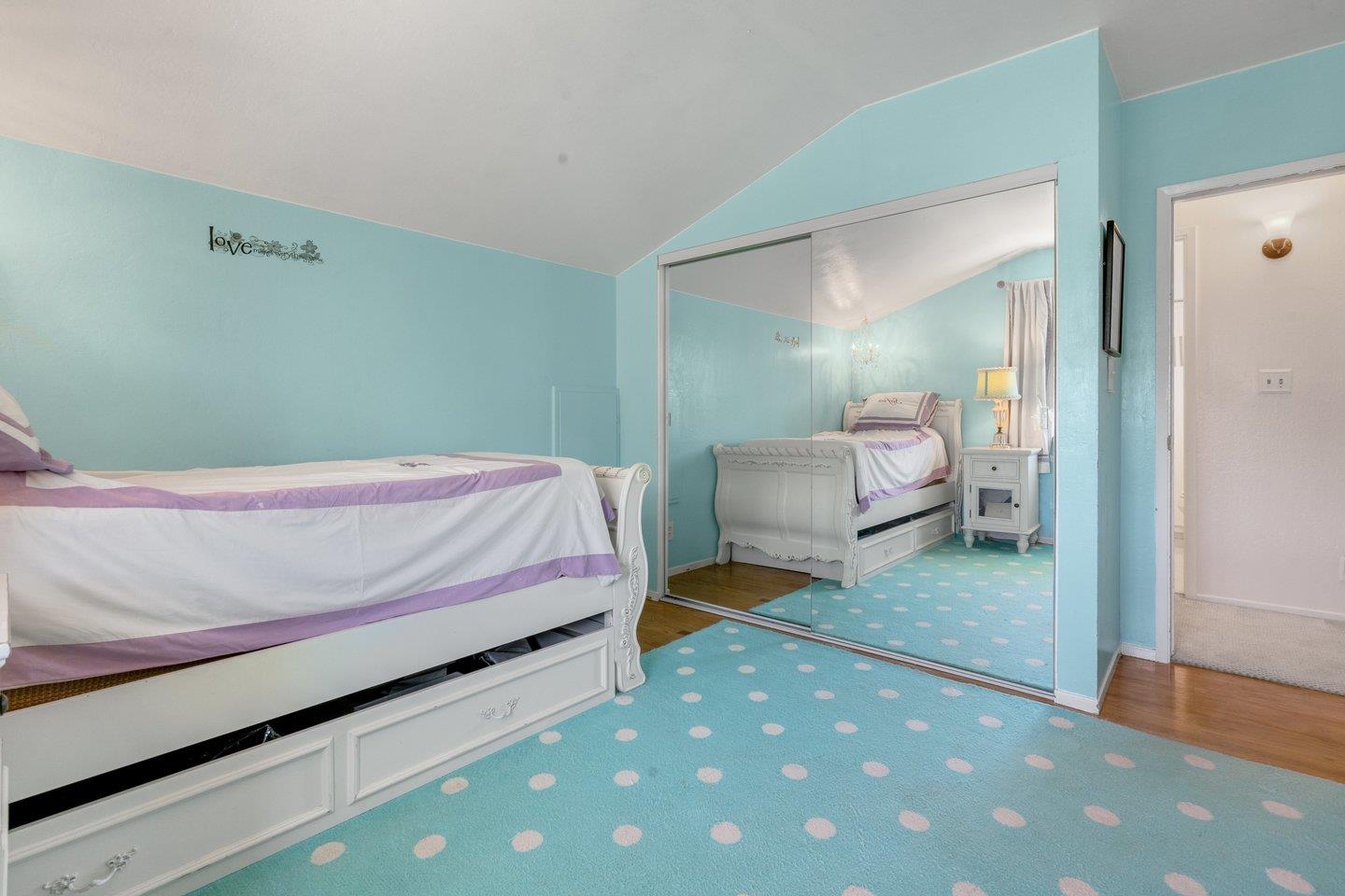 2289 Montezuma Drive Campbell, CA 95008 - Photo 30 of 46 a bedroom with a bed and a mirror