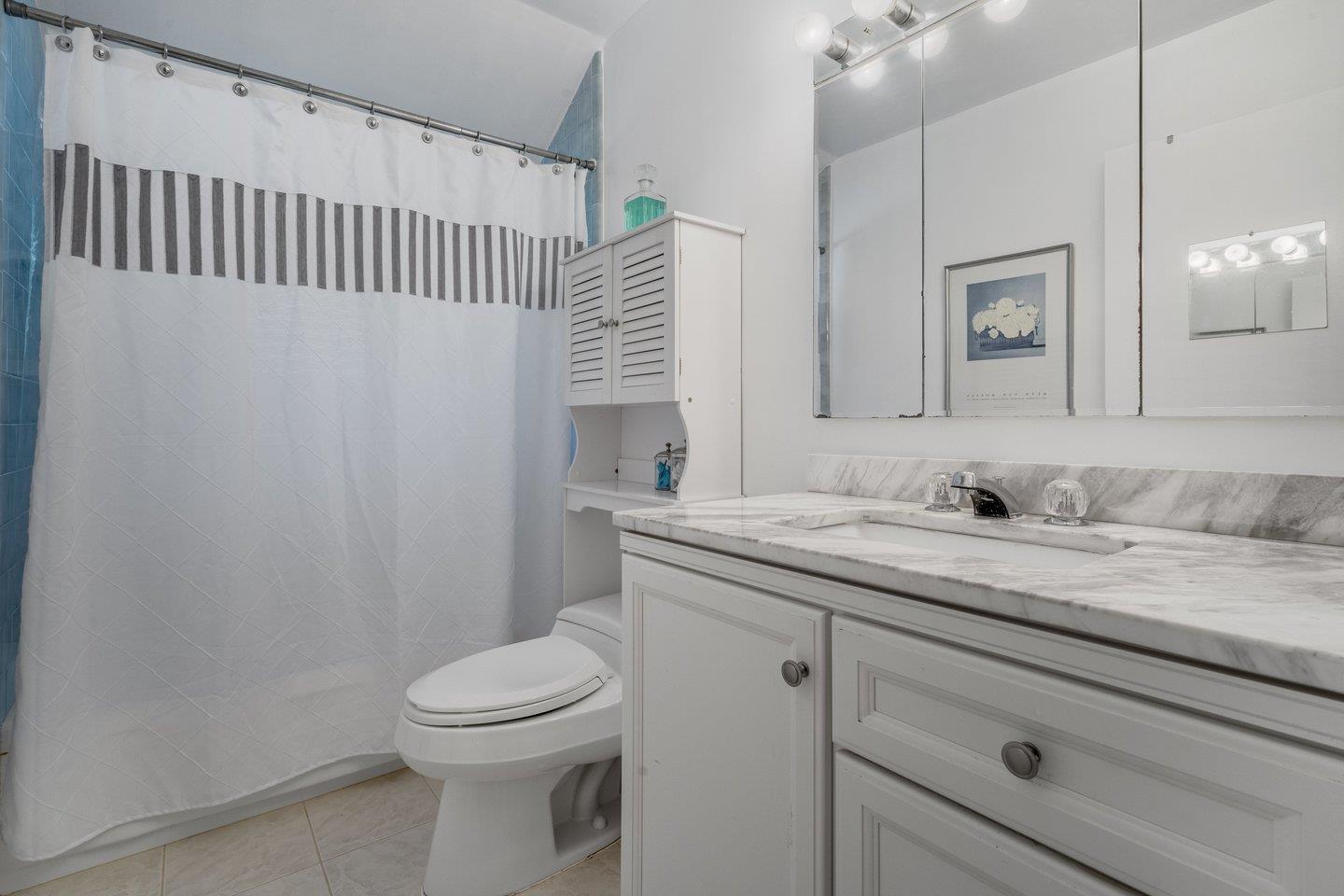 2289 Montezuma Drive Campbell, CA 95008 - Photo 31 of 46 a bathroom with a granite countertop sink a toilet and a mirror