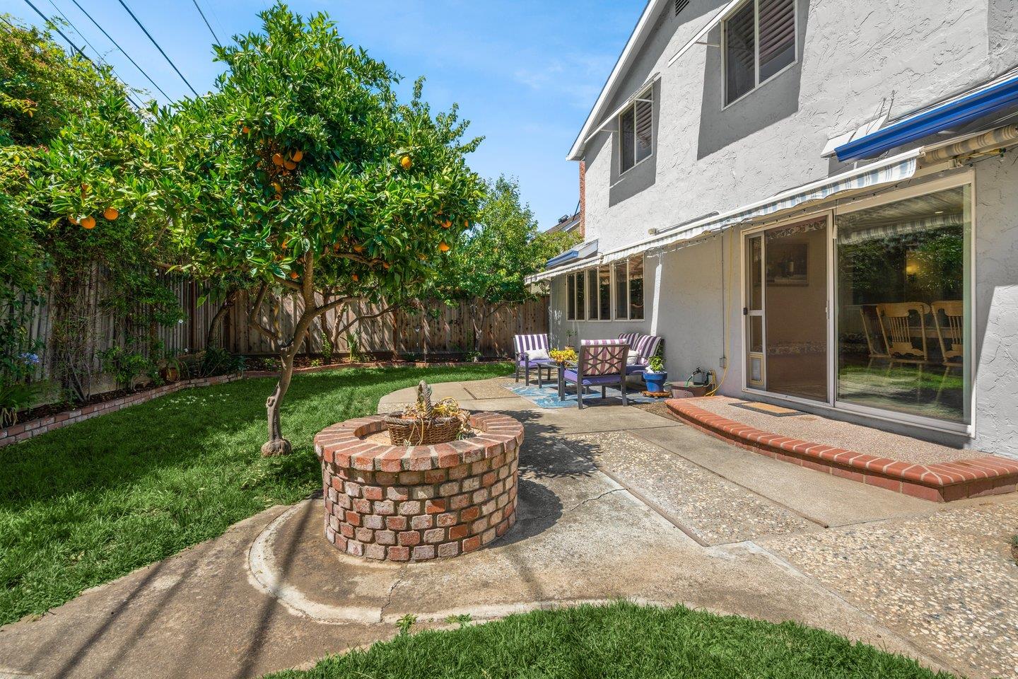 2289 Montezuma Drive Campbell, CA 95008 - Photo 36 of 46 a view of a patio with table and chairs potted plants and large tree