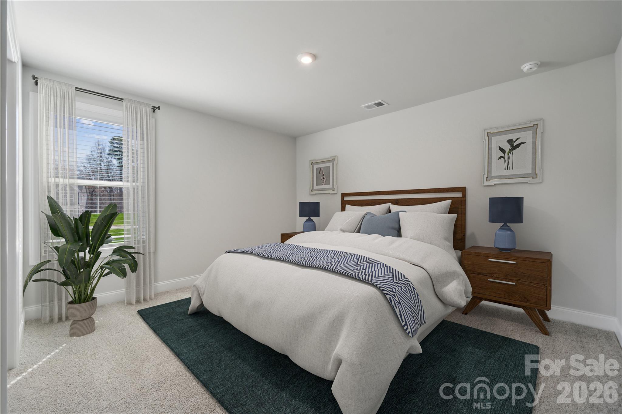 343 Alameda Way Matthews, NC 28104 - Photo 11 of 30 a bedroom with bed and a potted plant