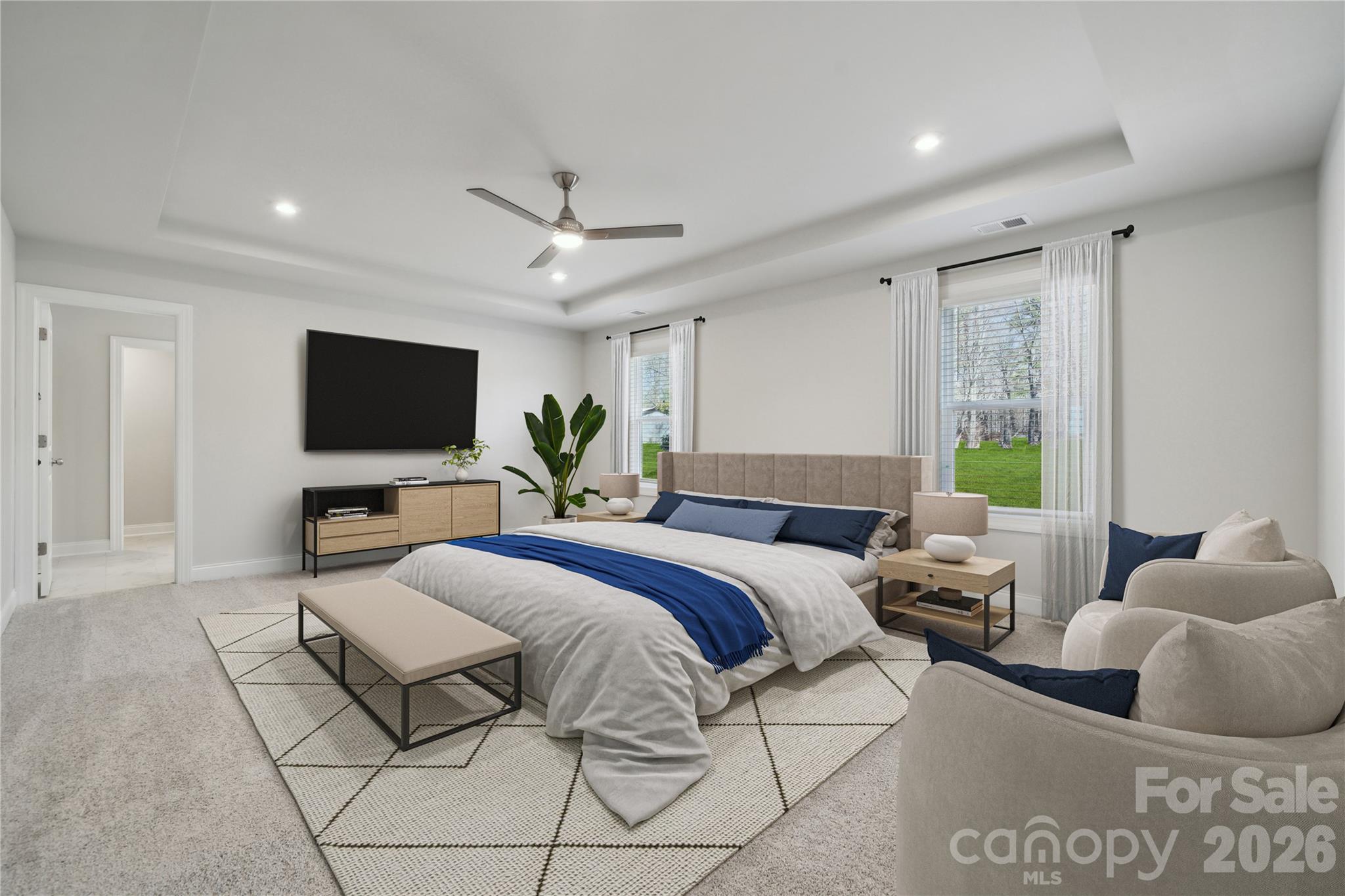 343 Alameda Way Matthews, NC 28104 - Photo 3 of 30 a spacious bedroom with a large bed and a flat screen tv