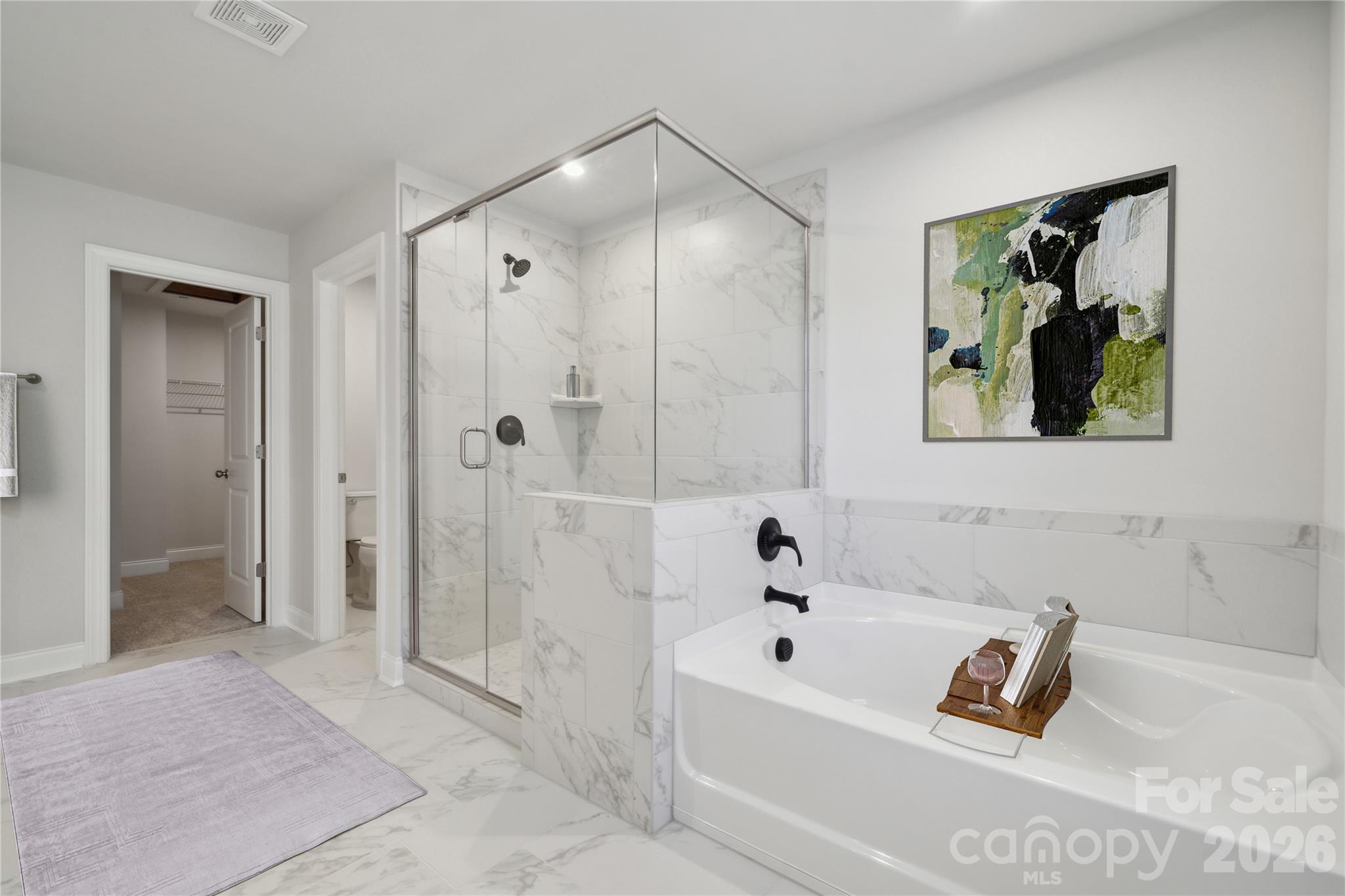 343 Alameda Way Matthews, NC 28104 - Photo 5 of 30 a bathroom with a bathtub and a shower