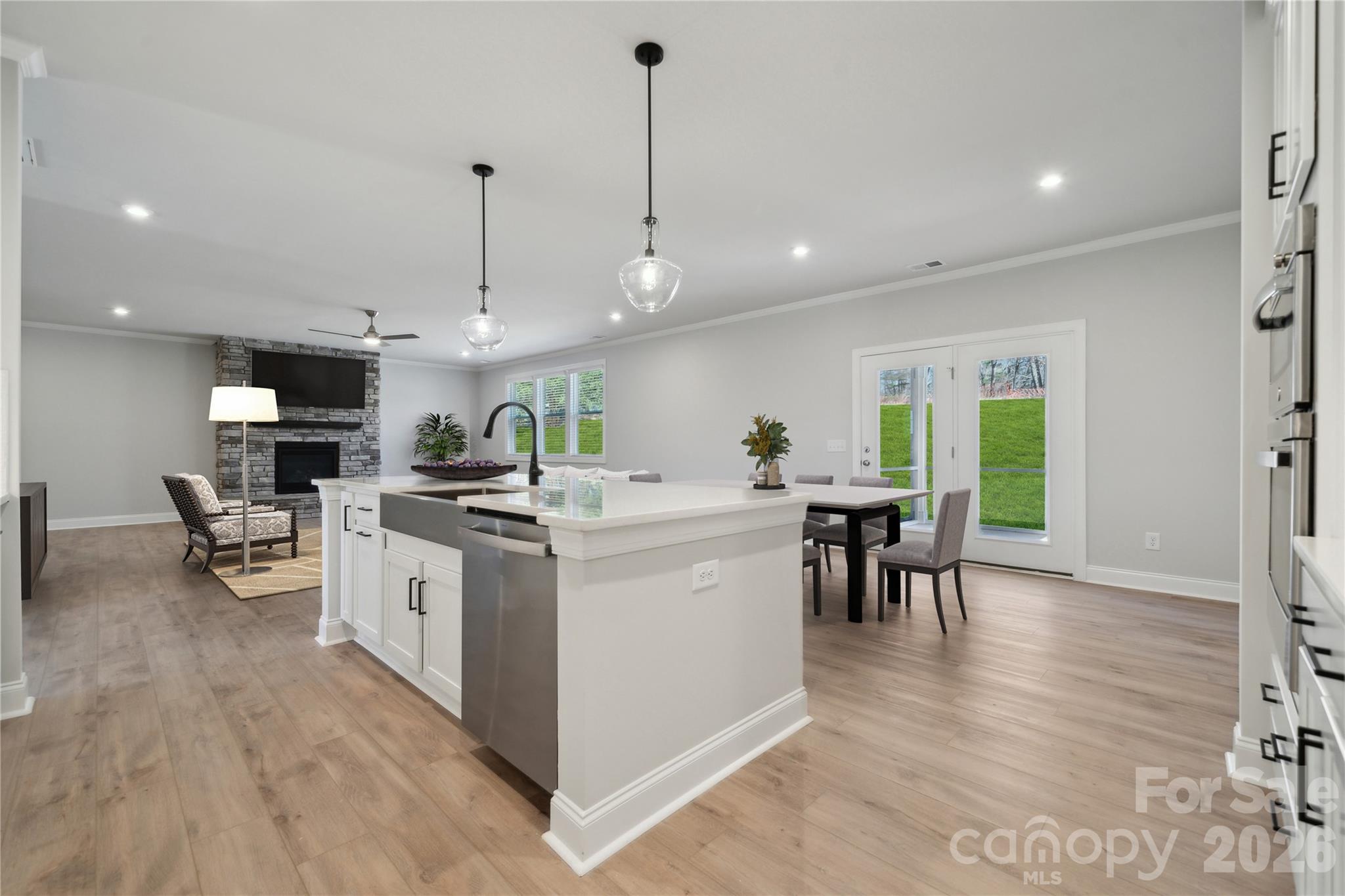343 Alameda Way Matthews, NC 28104 - Photo 6 of 30 a kitchen that has a lot of cabinets a sink and appliances in it