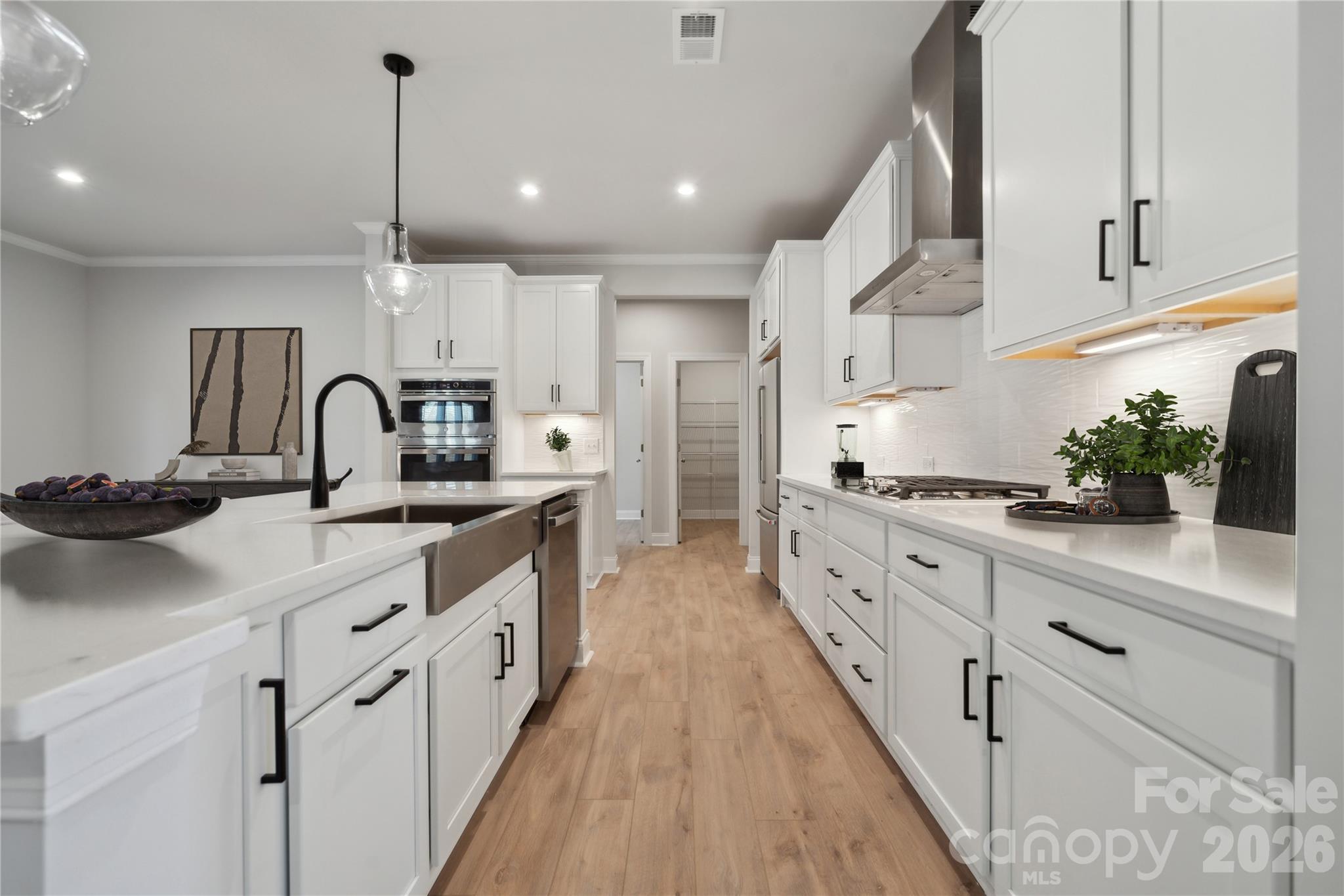 343 Alameda Way Matthews, NC 28104 - Photo 7 of 30 a kitchen with kitchen island granite countertop lots of counter top space and sink