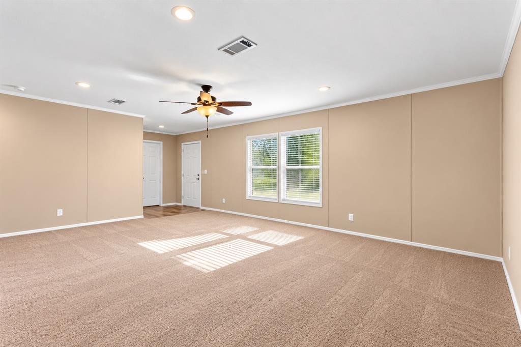 5519 Upper Denton Road Weatherford, TX 76085 - Photo 13 of 40 Expansive room featuring neutral-toned walls, recessed lighting, and a ceiling fan