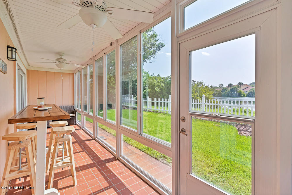 4 Ocean Trace Road, Unit 6 St. Augustine, FL 32080 - Photo 24 of 31 a view of a living room and a large window