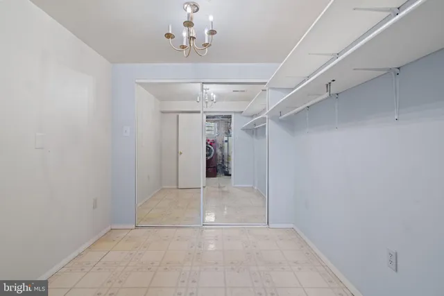 a view of a hallway with a chandelier