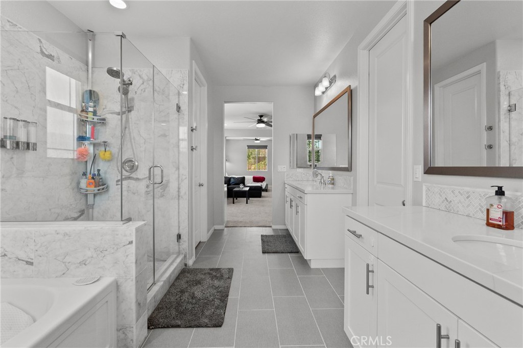 232 River Street Fillmore, CA 93015 - Photo 43 of 61 a bathroom with a sink a mirror and a shower