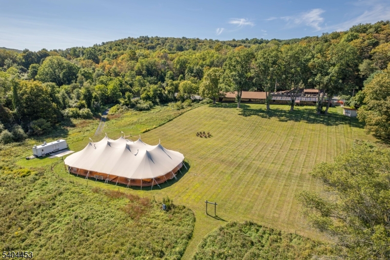 0 Rr 615 Layton, NJ 07851 - Photo 1 of 23 a view of a swimming pool with a yard and plants