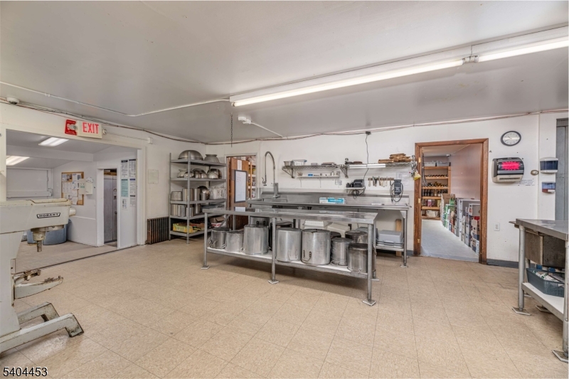 0 Rr 615 Layton, NJ 07851 - Photo 15 of 23 a living room with lots of furniture and clutter