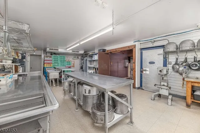 a dining room with furniture and a wooden floor