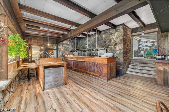 a view of a patio with table and chairs