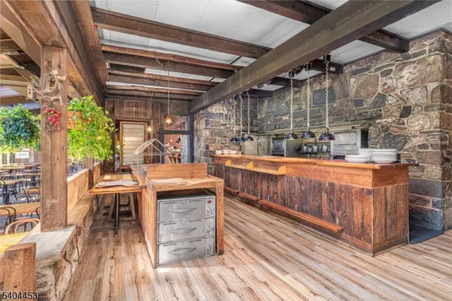 a view of a chairs and table on the deck with wooden floor