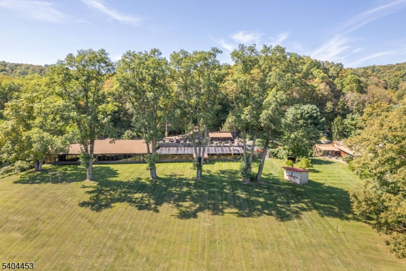 0 Rr 615 Layton, NJ 07851 - Photo 2 of 23 a backyard of a house with table and chairs