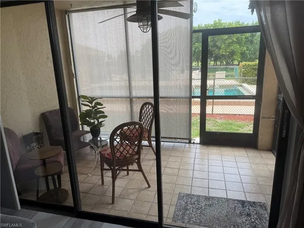a view of a dining room with furniture and window