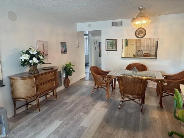 a living room with furniture and a chair