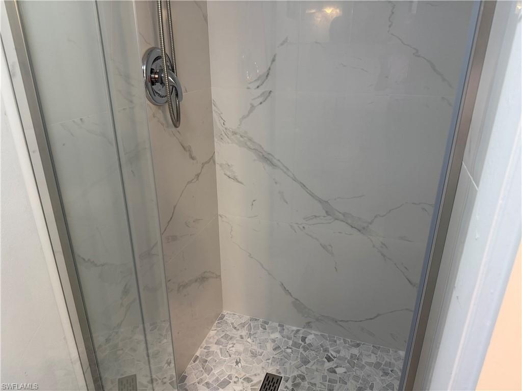 5535 Rattlesnake Hammock Road, Unit 104 Naples, FL 34113 - Photo 23 of 30 a bathroom with a shower