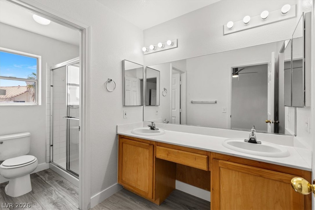 1412 Beaver Spring Street Las Vegas, NV 89128 - Photo 13 of 20 Double vanities and a spacious shower offer ultimate convenience in this well-appointed bath.