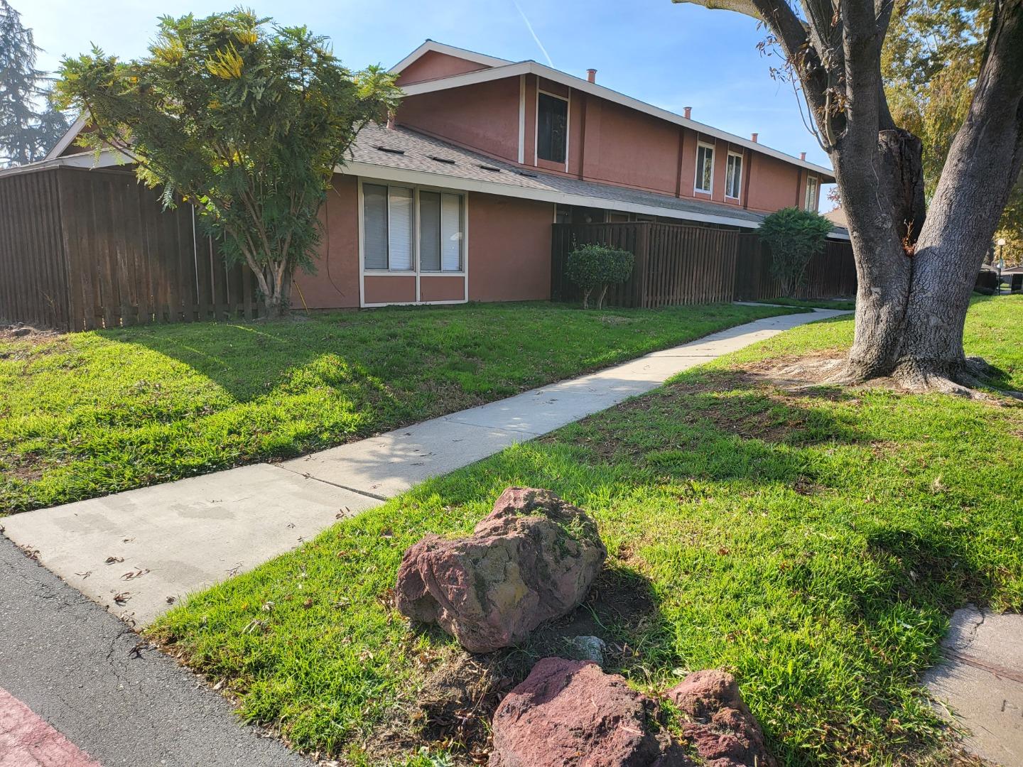 2081 Olivera Road, Unit I Concord, CA 94520 - Photo 2 of 23 a front view of a house with a yard