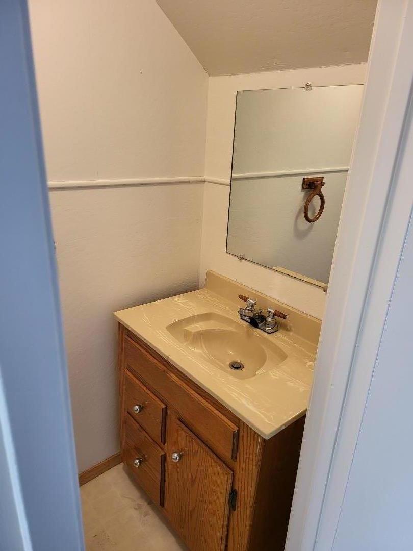 2081 Olivera Road, Unit I Concord, CA 94520 - Photo 11 of 23 a bathroom with a sink and vanity