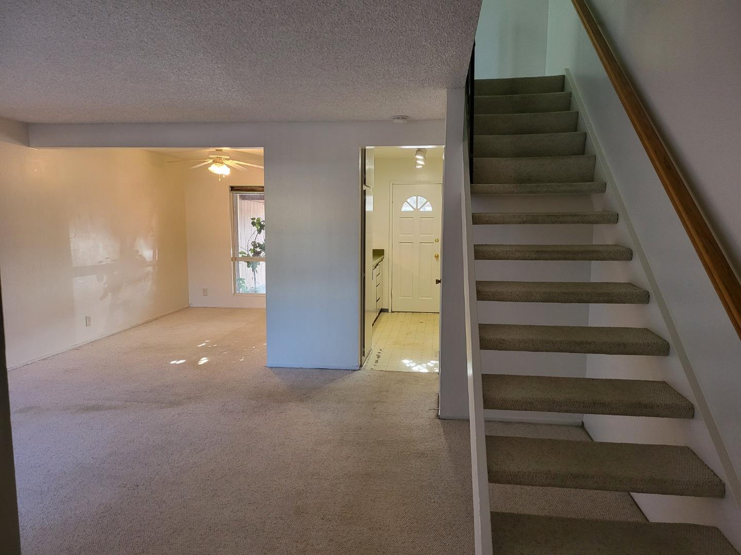 2081 Olivera Road, Unit I Concord, CA 94520 - Photo 13 of 23 a view of an empty room with stairs