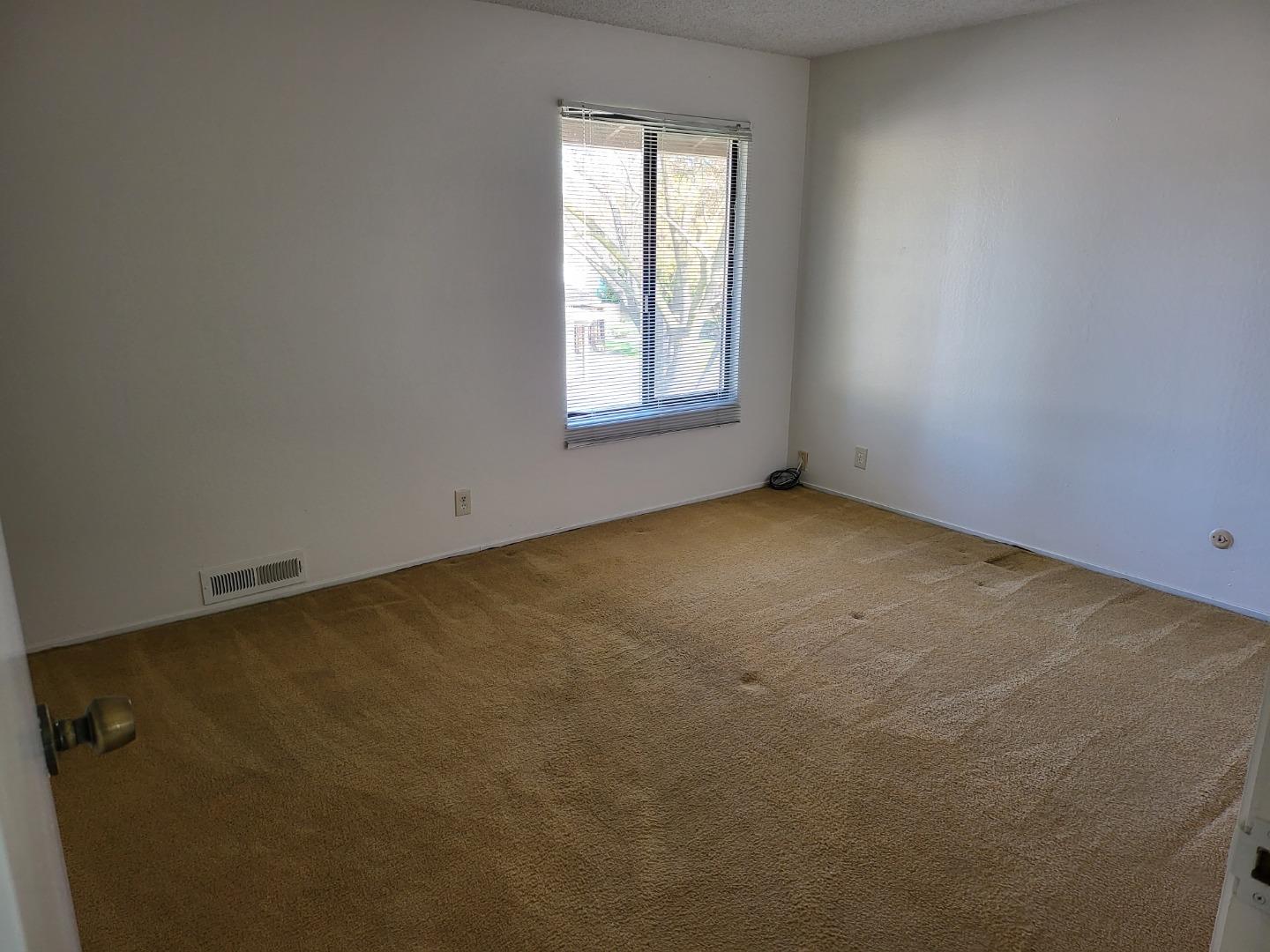 2081 Olivera Road, Unit I Concord, CA 94520 - Photo 14 of 23 an empty room with a window