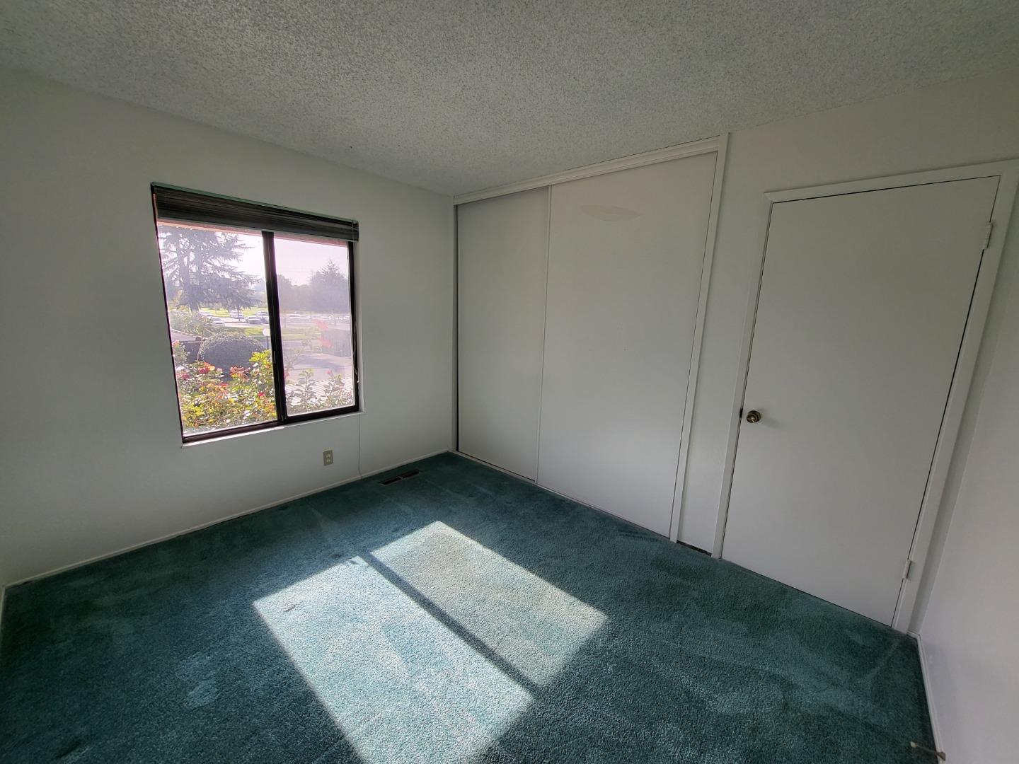 2081 Olivera Road, Unit I Concord, CA 94520 - Photo 17 of 23 a view of an empty room and window