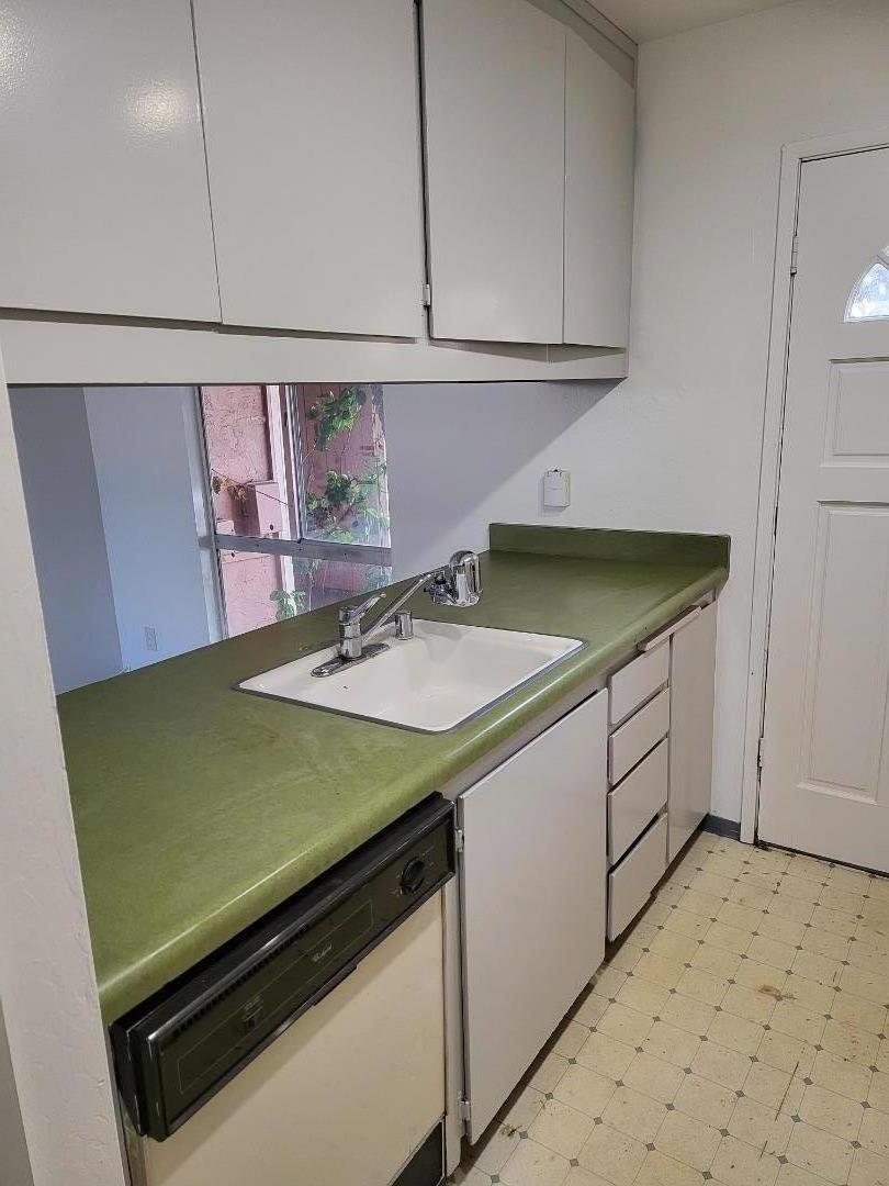 2081 Olivera Road, Unit I Concord, CA 94520 - Photo 5 of 23 a kitchen with a sink cabinets and wooden floor