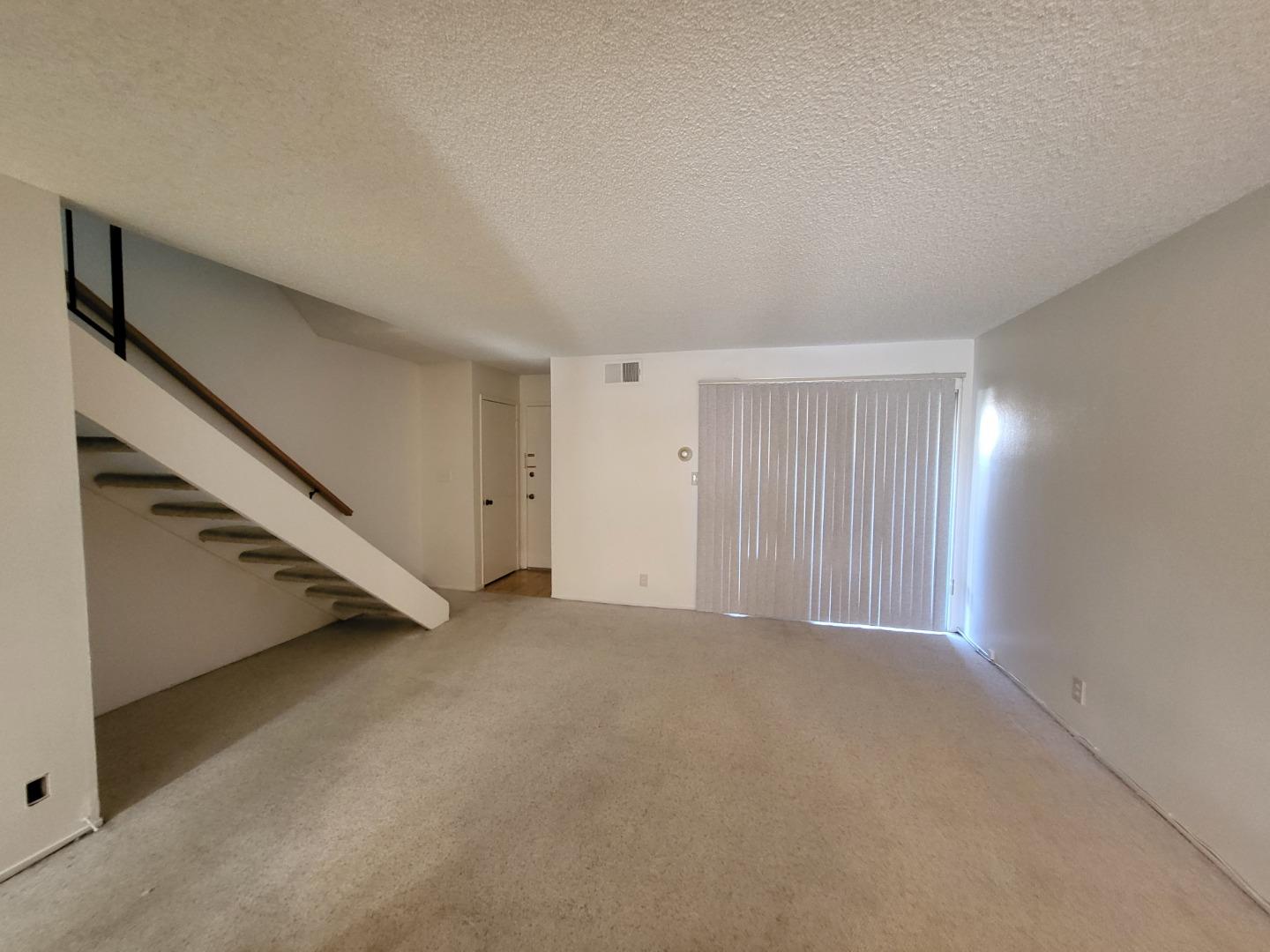 2081 Olivera Road, Unit I Concord, CA 94520 - Photo 7 of 23 a view of an empty room with a window