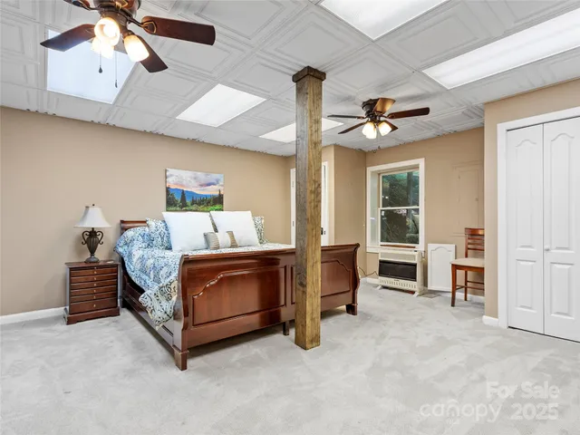 a bed room with a bed and a chair