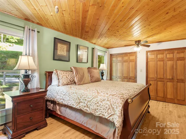a bath room with a bed and a dresser
